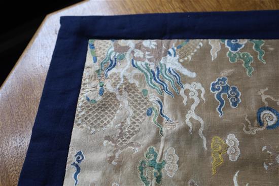 A Chinese brocade dragon panel fragment 17th/18th century, 80cm x 99cm including later border, professional repairs